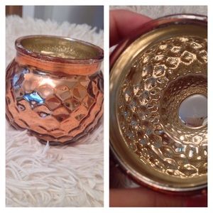 Candle holders one is gold and one is rose gold