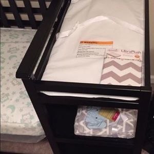 Baby crib with mattress included.