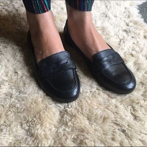 Low profile, minimal, black Born penny loafers