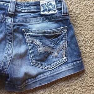 Shorts with metallic stitching