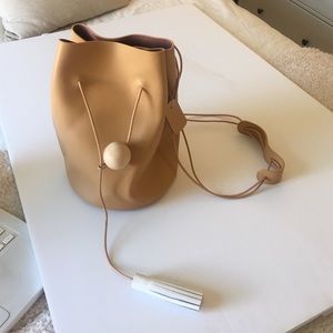 Unique drawstring tan leather bag