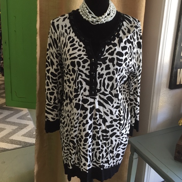 Beautiful animal print sweater with beaded neck.
