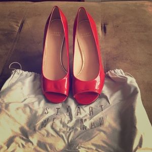 Peep toe red pumps