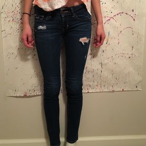 A dark pair of ripped Hollister jeans