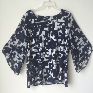 Woman's navy and off white shirt.