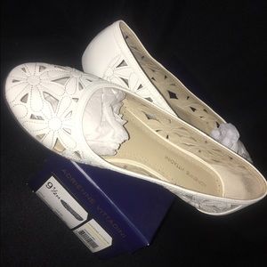 White leather flats with flower cut outs