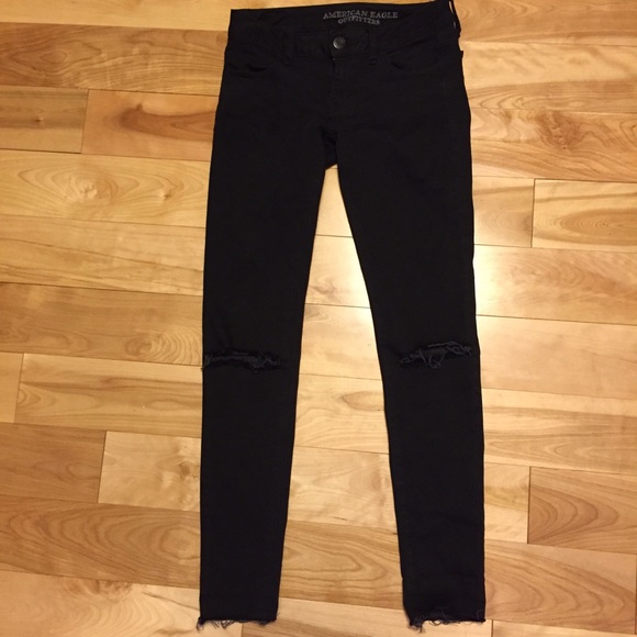 Black ripped knee jeans