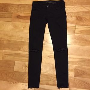 Black ripped knee jeans