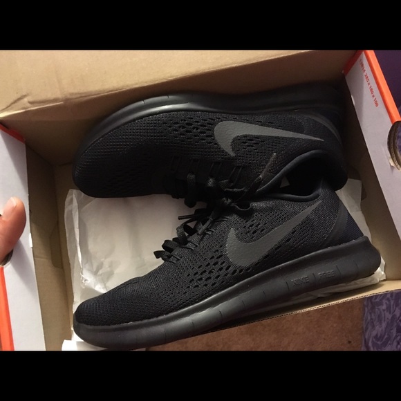 All black Nike shoes