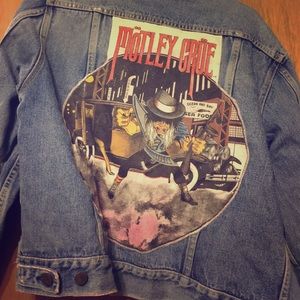 A stitched monthly crue jean jacket