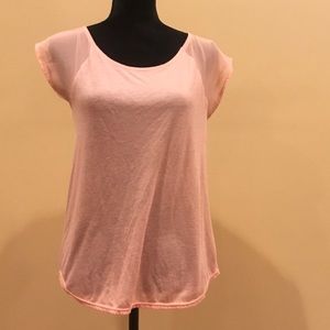 Peach colored tee with back zipper