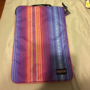 A multicolor Jansport laptop bag
