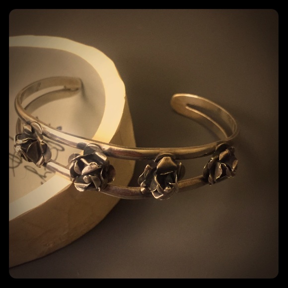 Silver rose cuff.