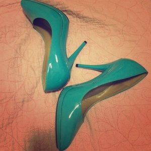 Bright blue patent leather pumps