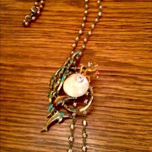 Dolphins jumping over sea shell