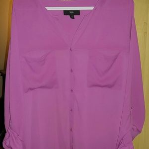 Pink long sleeved button up blouse.