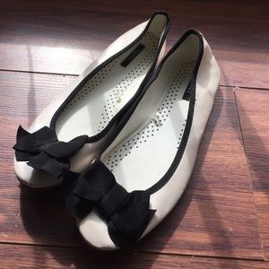 Cream and black flats