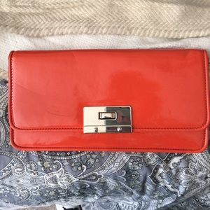Banana Republic Orange clutch (never been used)