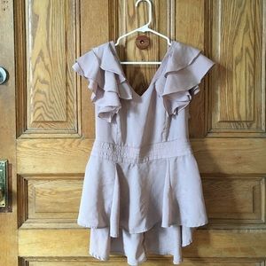 Pale pink ruffled peplum top