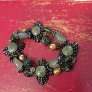 Bracelet with green, gold stones & metal pieces