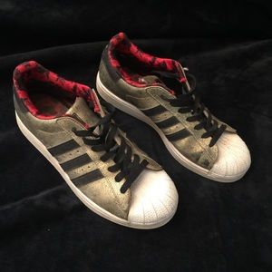 Gold Adidas superstar sneakers