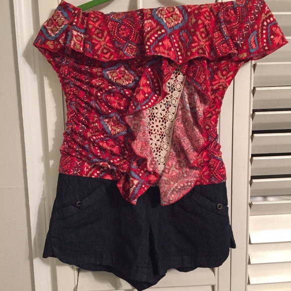 One piece off shoulder strapless short outfit.