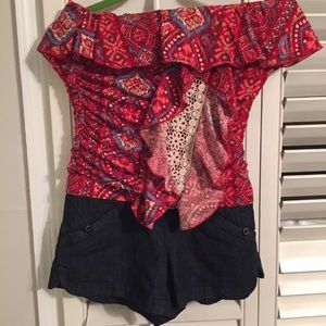 One piece off shoulder strapless short outfit.