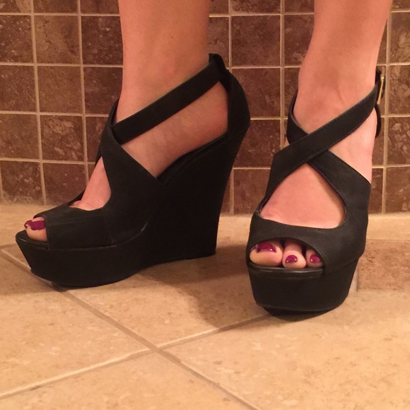 Platform peep toe wedges with cross front straps.