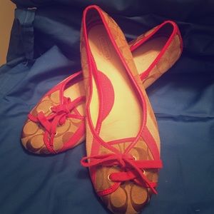 Pink women's Coach shoes.