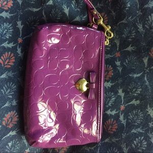 Purple Coach wristlet with gold heart, new w/o tag