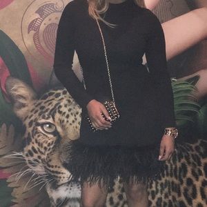 LBD... form fitting black dress W/sassy hem detail