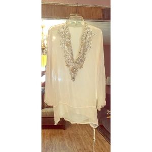 Gorgeous white coverup with beading and stones.