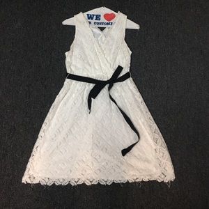 White lace dress with black bow