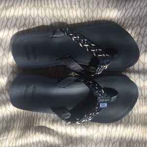 Navy blue TOMS flip flops