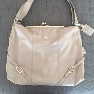 Large champagne colored shoulder bag by Emma Fox