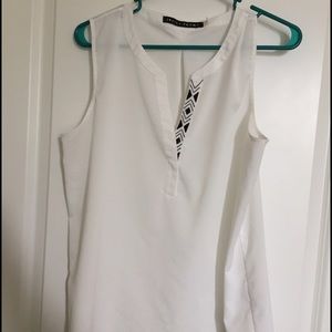 White sleeveless blouse