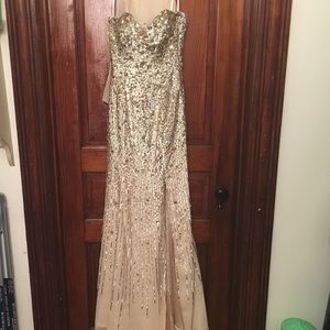 Gold and silver in cream floor length gown