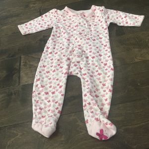 Bundle of baby clothes pictured.