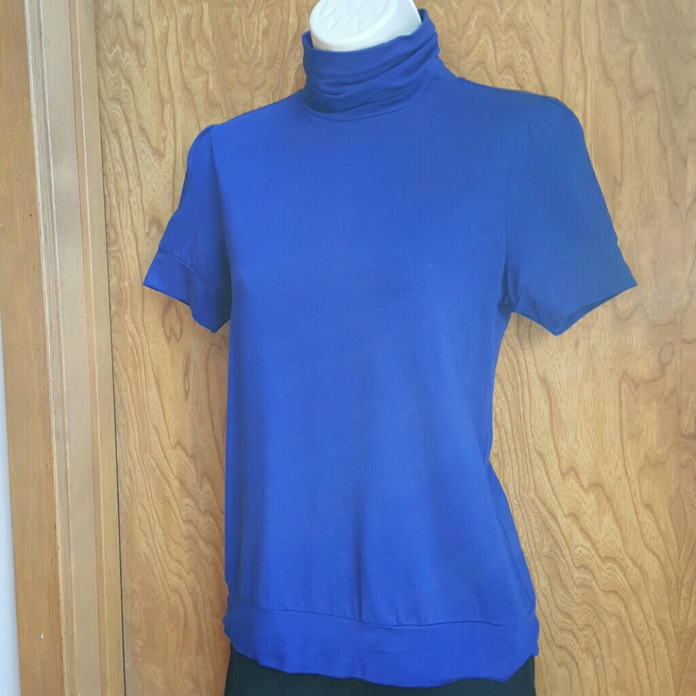Cobalt blue mock tneck. Short sleeved.