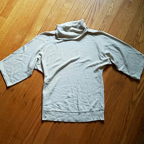 Light Brown turtleneck sweater.