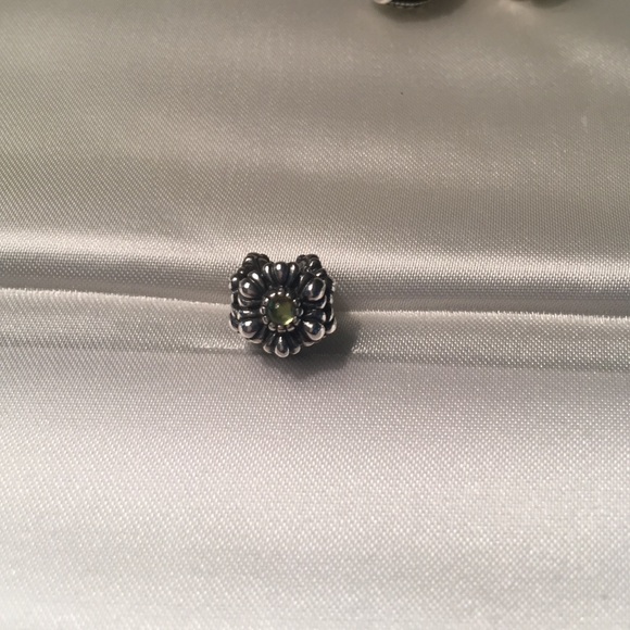 Pandora flower charm with peridot stones