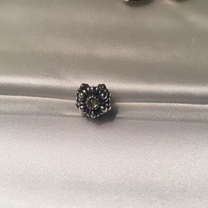 Pandora flower charm with peridot stones