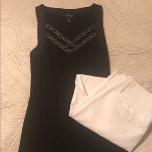 Black tank extra small but fits like a small