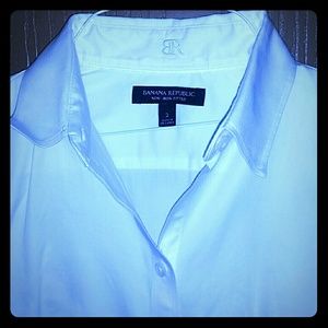 White button up blouse.