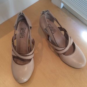 Tan shoes with brown trim