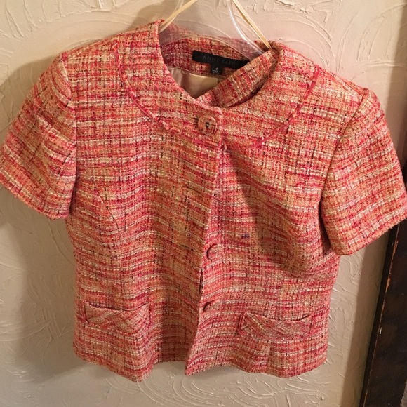 A short sleeved tweed suit with lining.