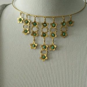 Gold choker with dangling gold tone flowers