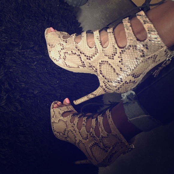Lace up snakeskin heels
