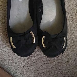 Black flats with bow and gold embellishment