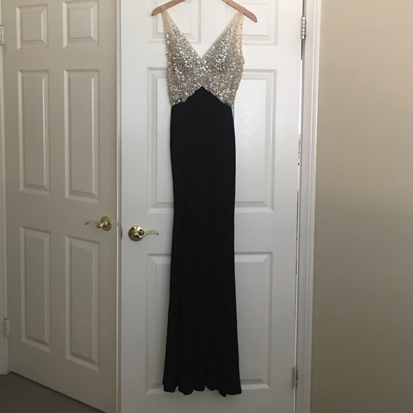 Dresses & Skirts - Black dress with embellished top.